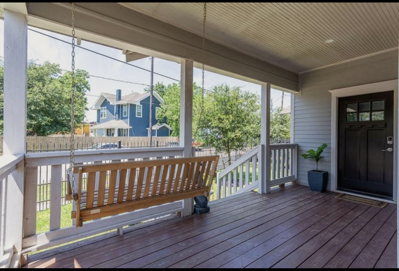 Covered front porch with porch swing at 4121 Rusk Street